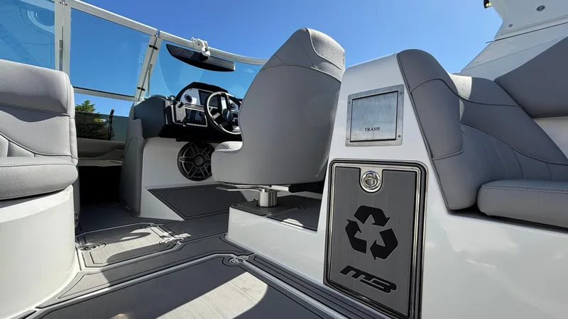 Slide: The Image of Interior of 2025 MB B52 25 Alpha boat with modern seating and dashboard. - 24
