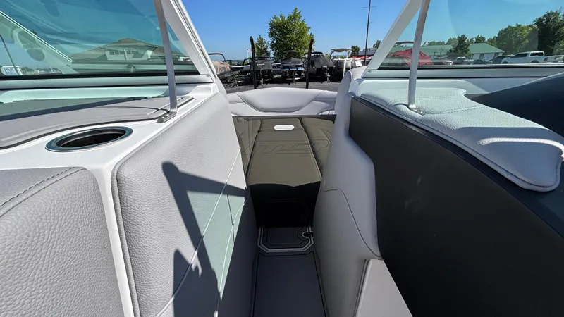 Slide: The Image of Interior of 2025 MB B52 25 Alpha boat, featuring sleek seating and cup holder. - 41