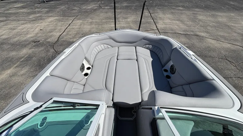 Slide: The Image of 2025 MB B52 25 Alpha boat interior with gray seating and cup holders. - 43