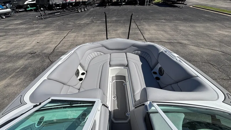 Slide: The Image of 2025 MB B52 25 Alpha boat interior with gray seating and speakers. - 44