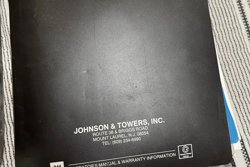 Slide: The Image of Black manual cover for Trojan 12 Meter Convertible, 1988, by Johnson & Towers, Inc. - 50