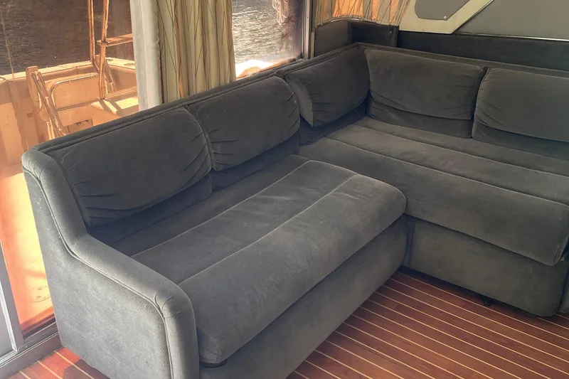 Slide: The Image of Luxurious interior of 1988 Trojan 12 Meter Convertible with plush gray seating. - 34