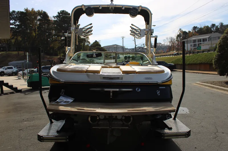 Slide: The Image of 2013 MasterCraft X-2 boat on trailer, rear view in outdoor setting. - 21