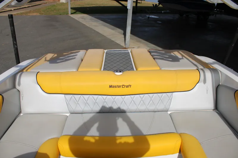 Slide: The Image of 2013 MasterCraft X-2 boat interior with yellow and gray seating. - 30