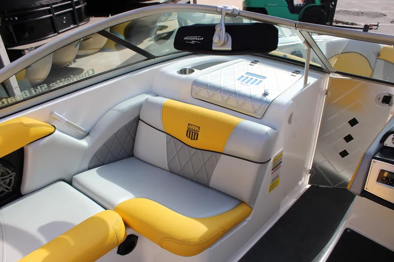 Slide: The Image of 2013 MasterCraft X-2 boat interior with yellow and white seating, diamond stitching. - 31