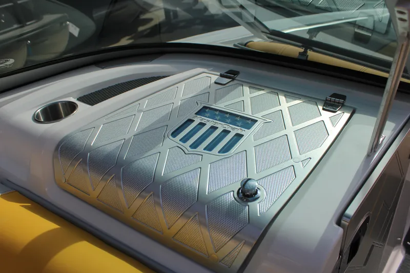 Slide: The Image of 2013 MasterCraft X-2 boat dashboard with metallic detailing and cup holder. - 40