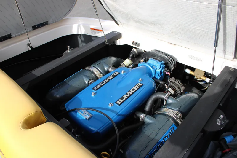 Slide: The Image of 2013 MasterCraft X-2 boat engine with blue Ilmor cover, detailed view. - 41
