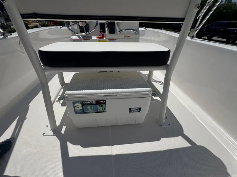 Slide: The Image of 2025 Robalo R160 Center Console boat interior with Igloo cooler under seat. - 21