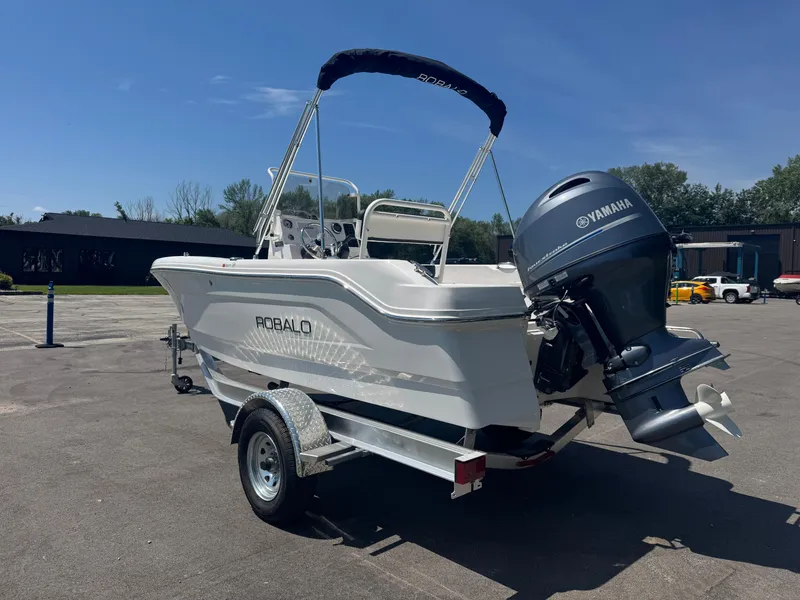 Slide: The Image of 2025 Robalo R160 Center Console boat with Yamaha engine on trailer. - 5