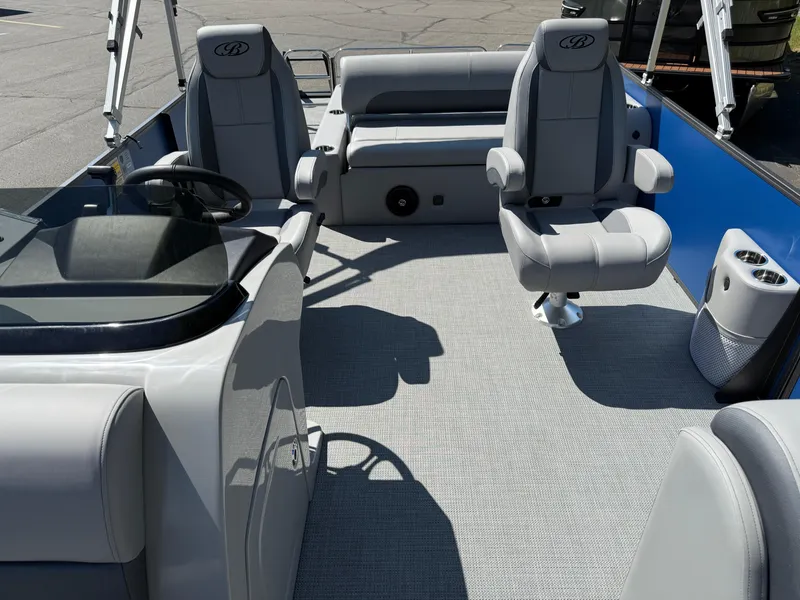 Slide: The Image of 2026 Bentley Pontoons Legacy 243 Swingback Dual Capt. interior with gray seating and modern design. - 15