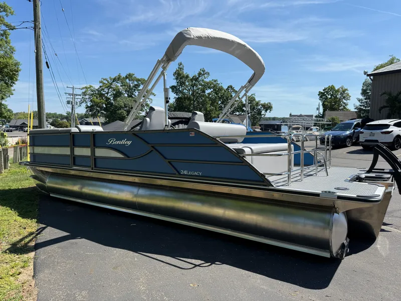 Slide: The Image of 2026 Bentley Pontoons Legacy 243 Swingback Dual Capt. on display, featuring sleek design and modern amenities. - 2
