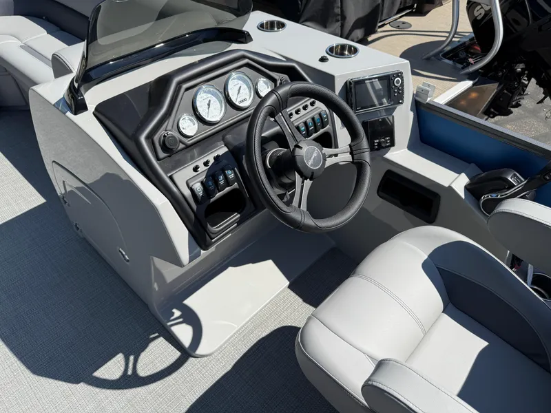 Slide: The Image of 2026 Bentley Pontoons Legacy 243 Swingback Dual Capt. helm with modern controls and steering wheel. - 22
