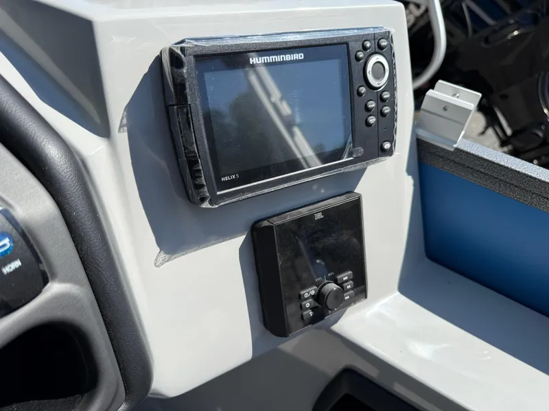 Slide: The Image of 2026 Bentley Pontoons Legacy 243 dashboard with Humminbird Helix 5 and JBL controls. - 27