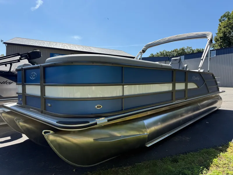 Slide: The Image of 2026 Bentley Pontoons Legacy 243 Swingback Dual Capt. in a sunny outdoor setting. - 3