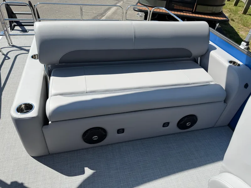 Slide: The Image of 2026 Bentley Pontoons Legacy 243 Swingback Dual Capt. with gray seating and cup holders. - 32