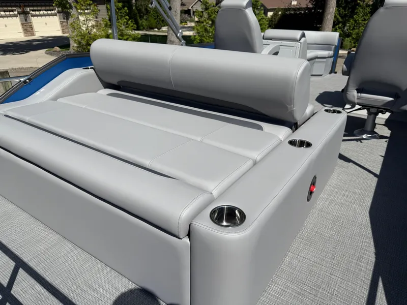 Slide: The Image of 2026 Bentley Pontoons Legacy 243 Swingback Dual Capt. with sleek gray seating and cup holders. - 33