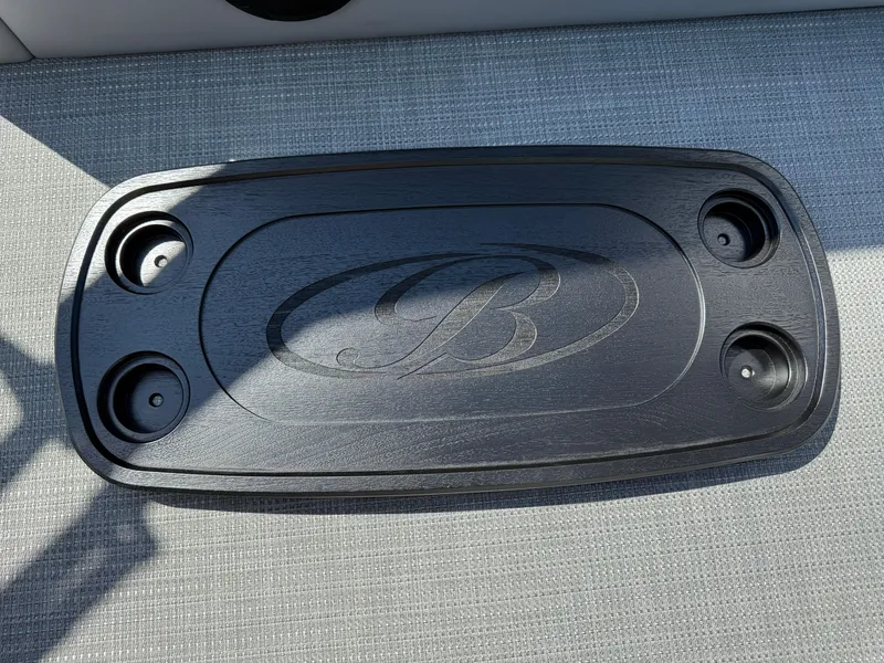 Slide: The Image of Black cup holder tray with logo on Bentley Pontoons Legacy 243 Swingback Dual Capt. 2026. - 39