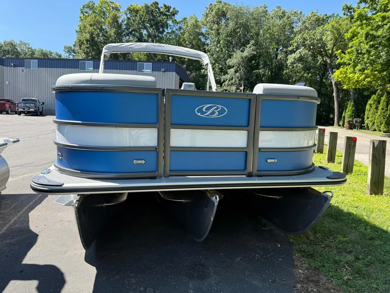 Slide: The Image of 2026 Bentley Pontoons Legacy 243 Swingback Dual Capt. in a parking lot, sunny day. - 4