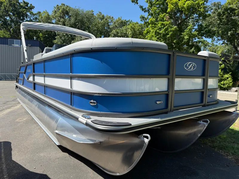 Slide: The Image of 2026 Bentley Pontoons Legacy 243 Swingback Dual Capt. in blue, docked outdoors. - 5