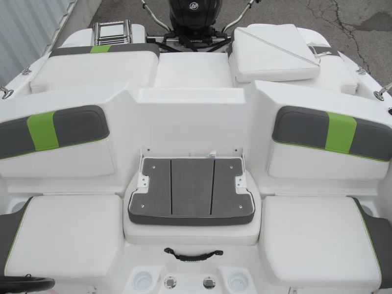 Slide: The Image of 2023 Tahoe T16 boat interior with white and green seating, featuring a compact layout. - 12
