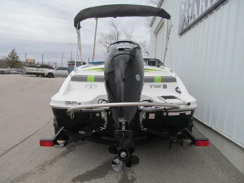 Slide: The Image of 2023 Tahoe T16 boat rear view with outboard motor and trailer. - 4