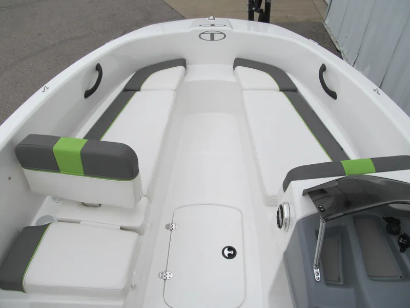 Slide: The Image of 2023 Tahoe T16 boat interior with white and green seating, modern design. - 7
