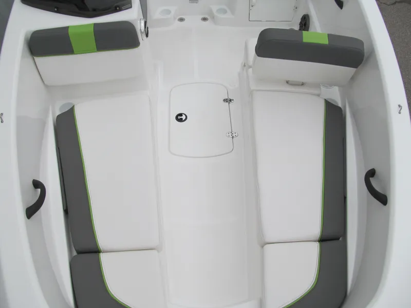 Slide: The Image of 2023 Tahoe T16 boat interior with white and green cushioned seating. - 9