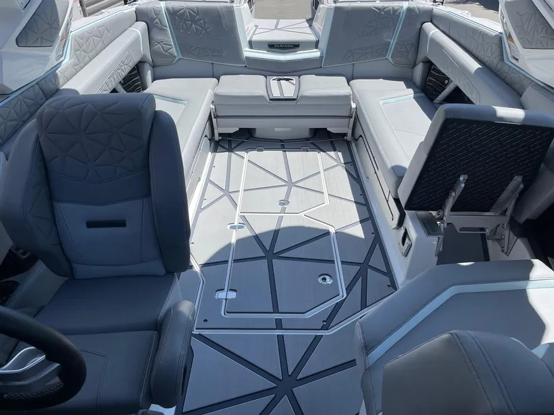 Slide: The Image of Luxurious interior of 2025 Nautique Super Air Nautique G25 Paragon boat, featuring modern seating. - 12