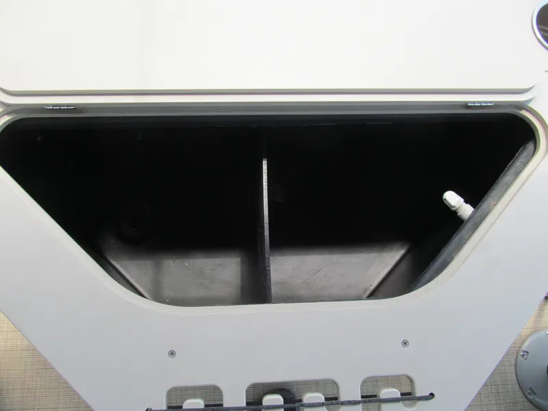 Slide: The Image of Storage compartment of a 2018 Berkshire 17A CTS boat, featuring a black interior. - 11
