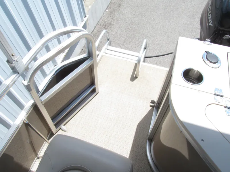 Slide: The Image of 2018 Berkshire 17A CTS boat deck with railing and Mercury engine. - 13