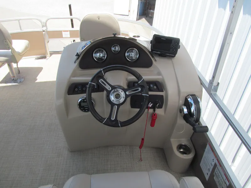 Slide: The Image of Steering console of a 2018 Berkshire 17A CTS boat with gauges and controls. - 6