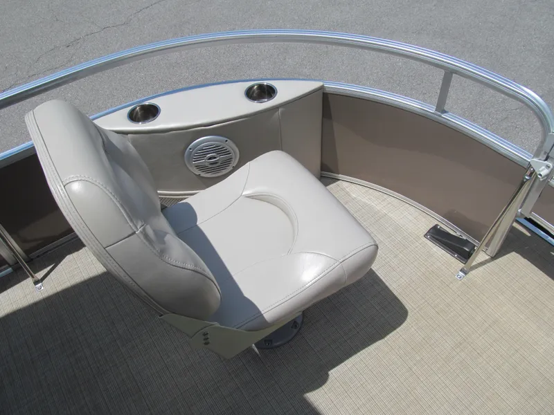 Slide: The Image of Captain's chair on 2018 Berkshire 17A CTS pontoon boat, featuring cup holders and speaker. - 8