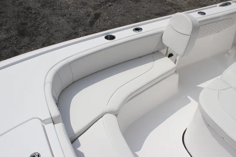 Slide: The Image of 2026 Tidewater 2700 Carolina Bay boat with white cushioned seating. - 13