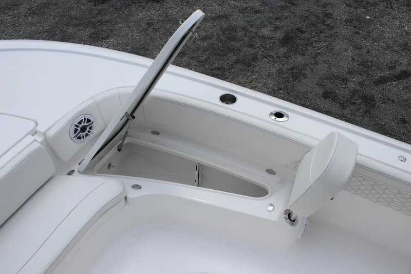 Slide: The Image of 2026 Tidewater 2700 Carolina Bay boat interior with open storage compartment. - 17