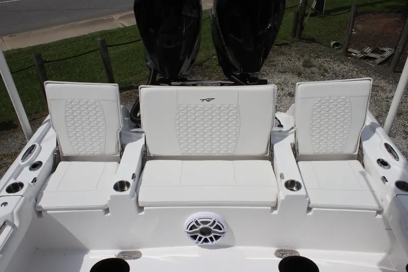 Slide: The Image of 2026 Tidewater 2700 Carolina Bay boat seating with cup holders and speaker. - 29