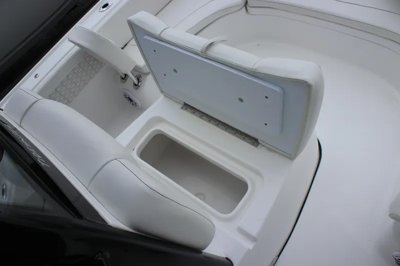Slide: The Image of 2026 Tidewater 2700 Carolina Bay boat interior with open storage compartment. - 35