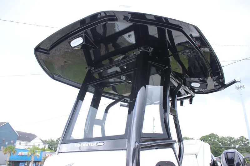 Slide: The Image of 2026 Tidewater 2700 Carolina Bay boat with sleek black T-top design. - 37