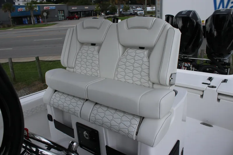 Slide: The Image of 2026 Tidewater 2700 Carolina Bay boat with luxurious white seating and modern design. - 38