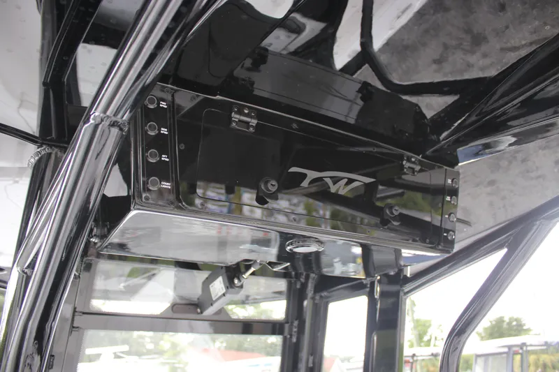 Slide: The Image of Tidewater 2700 Carolina Bay 2026 boat console with sleek black design and controls. - 39