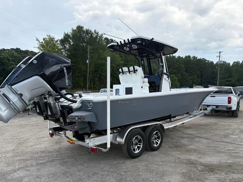 Slide: The Image of 2026 Tidewater 2700 Carolina Bay boat on trailer, featuring Mercury outboard engine. - 5