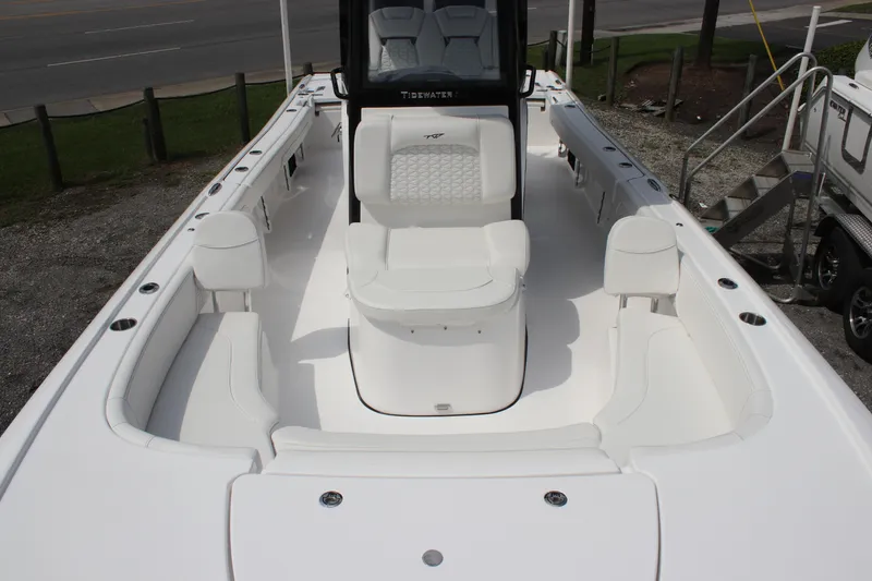 Slide: The Image of 2026 Tidewater 2700 Carolina Bay boat interior with white seating and console. - 9