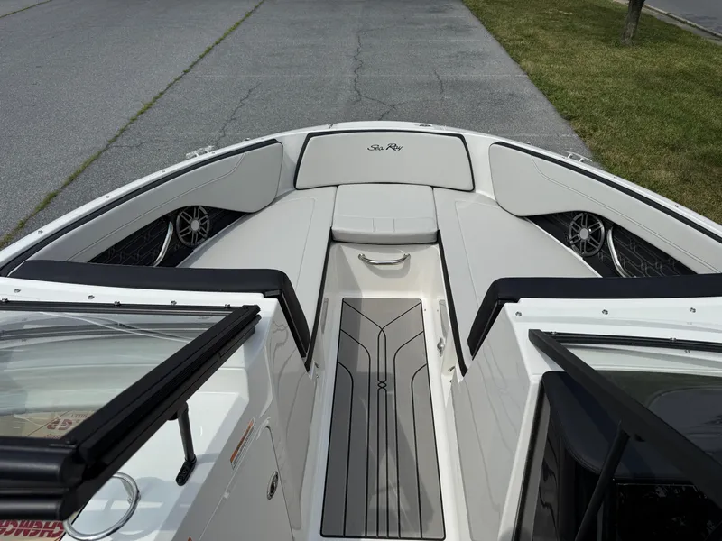 Slide: The Image of 2026 Sea Ray SPX 210 Outboard boat interior with sleek seating and modern design. - 13