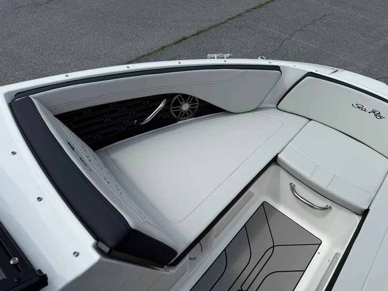 Slide: The Image of 2026 Sea Ray SPX 210 Outboard boat interior with sleek seating and modern design. - 14