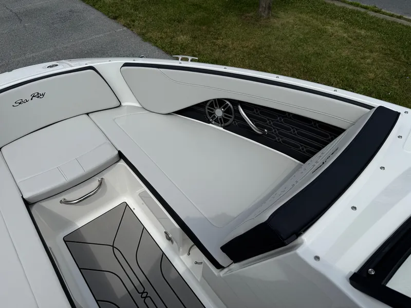 Slide: The Image of 2026 Sea Ray SPX 210 Outboard boat interior with sleek seating and modern design. - 15