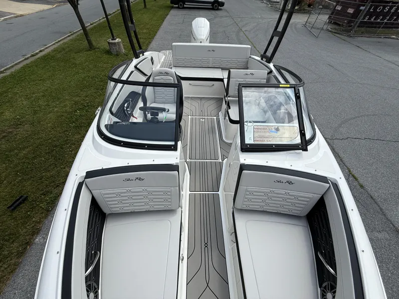 Slide: The Image of 2026 Sea Ray SPX 210 Outboard boat interior with sleek seating and modern design. - 16