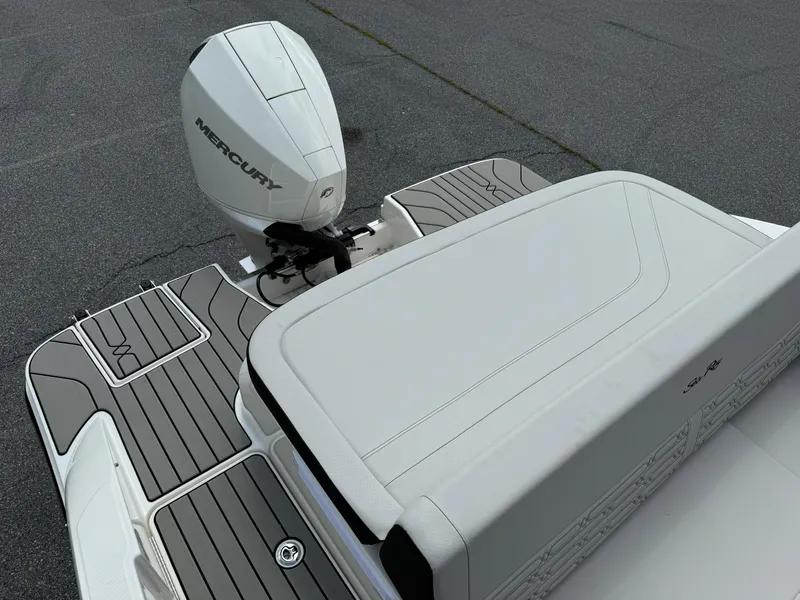 Slide: The Image of 2026 Sea Ray SPX 210 Outboard boat with Mercury engine, featuring sleek deck design. - 17