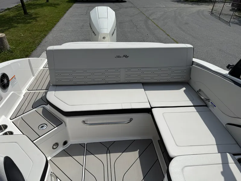 Slide: The Image of 2026 Sea Ray SPX 210 Outboard boat interior with white seating and sleek design. - 7