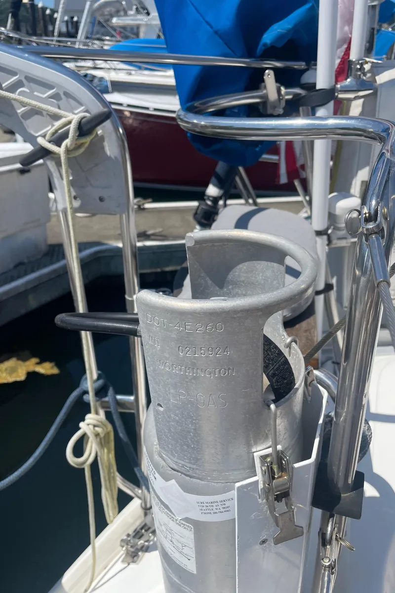 Slide: The Image of Sailboat deck with propane tank holder on Jeanneau Sun Odyssey 36, 1990 model. - 14