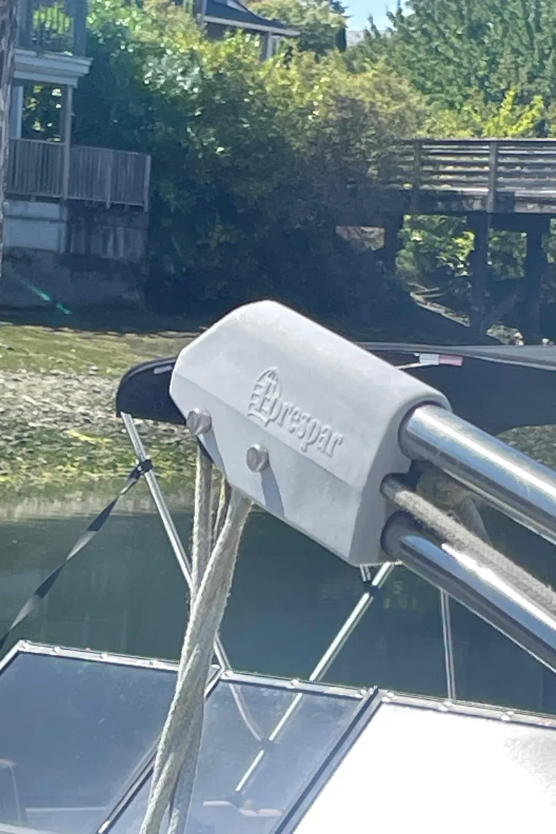 Slide: The Image of Close-up of a 1990 Jeanneau Sun Odyssey 36 sailboat rigging with trees in the background. - 19