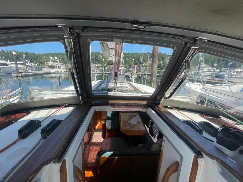 Slide: The Image of Interior view of 1990 Jeanneau Sun Odyssey 36 sailboat docked at marina. - 20